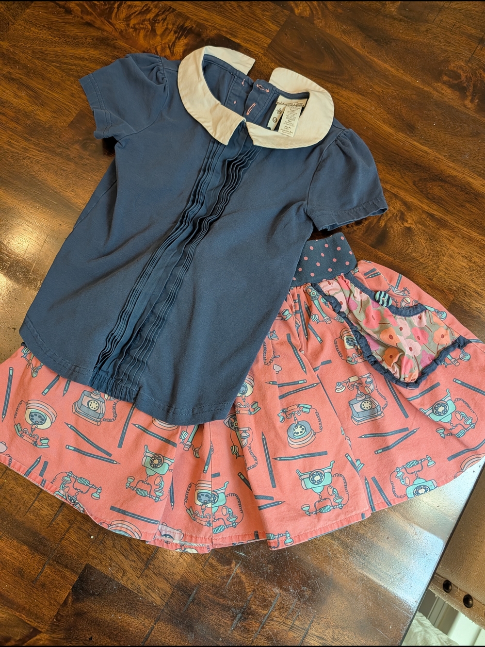 Matilda Jane navy blue top with white collar and pink patterned skirt